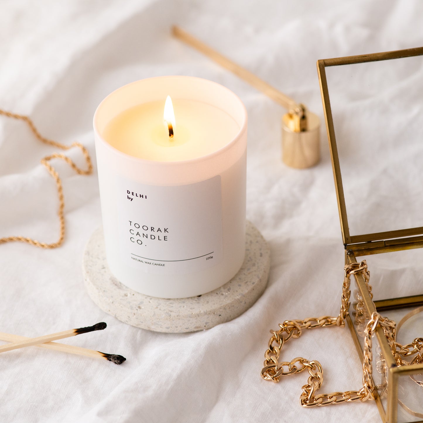 Delhi lit candle with jewellery