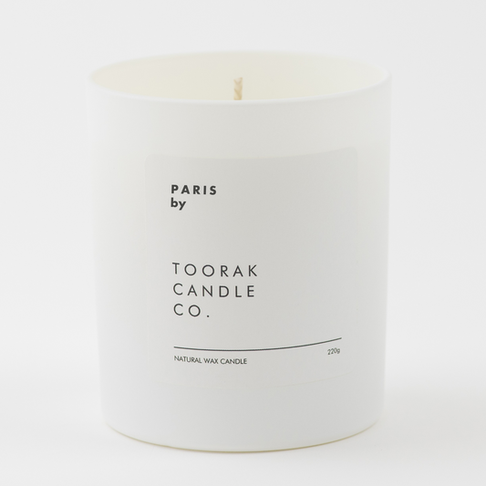 PARIS natural wax candle on plain white background