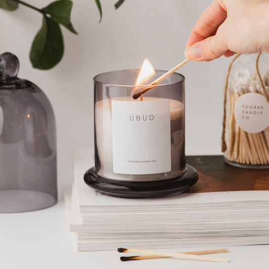 Ubud luxury cloche candle being lit 