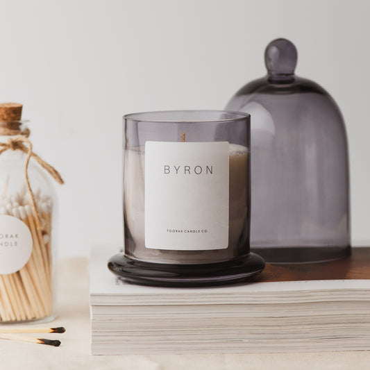 Byron grey cloche candle on books
