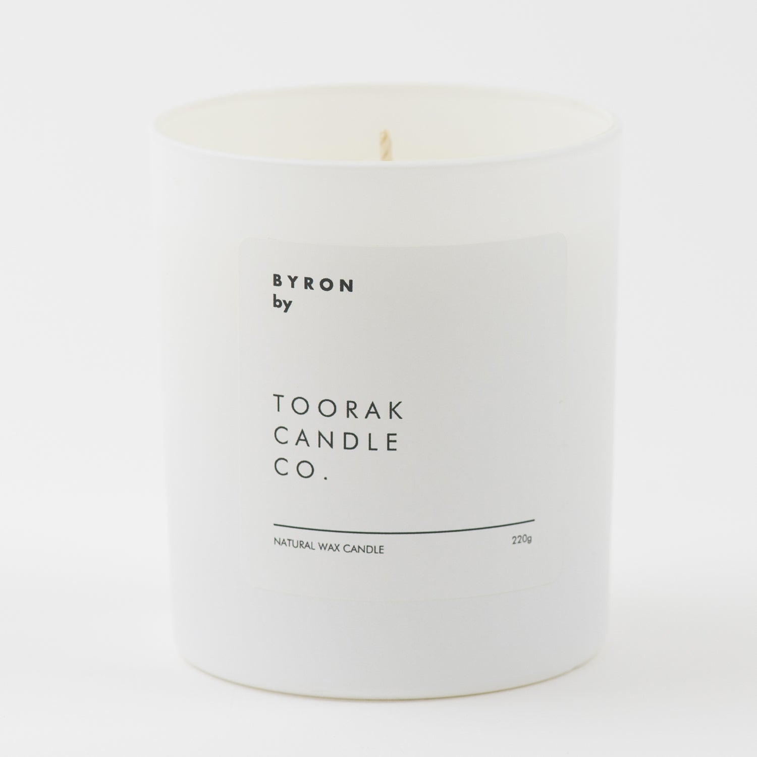 BYRON natural wax candle on plain white background 