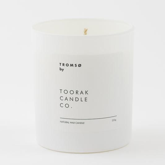 TROMSO natural wax candle on a plain white background